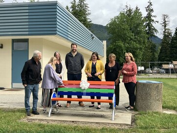 Photo from left: Sicamous Mayor Terry Rysz, Grade 6 student Hazel Spanke, Carol-Ann Leidloff and Ryan Brennan (SD#83), Tracey Wiebe (Parkview PAC), Principal Carla Schneider and PAC President Siobhan Rich unveil the new Buddy Bench at Parkview Elementary